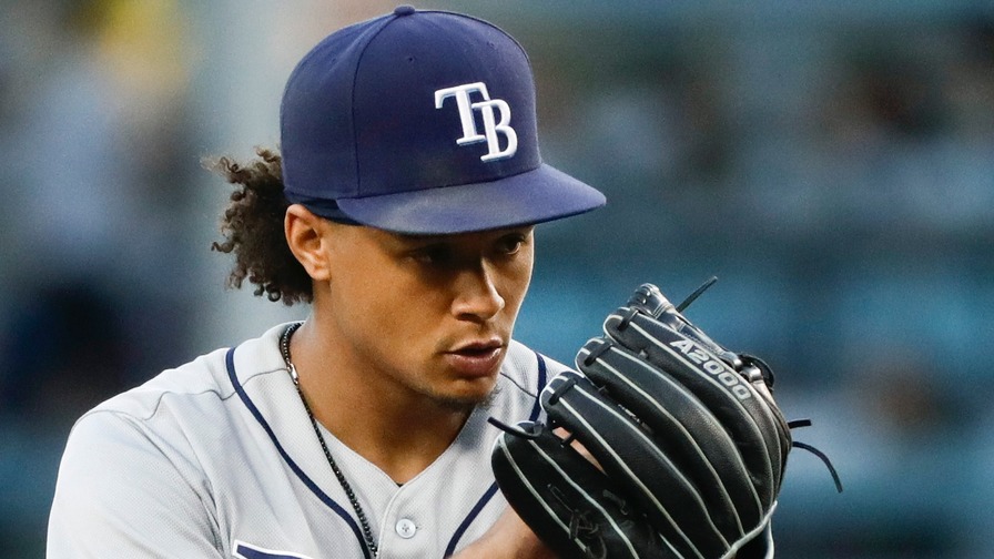 An American professional baseball player, Chris Archer holds a net